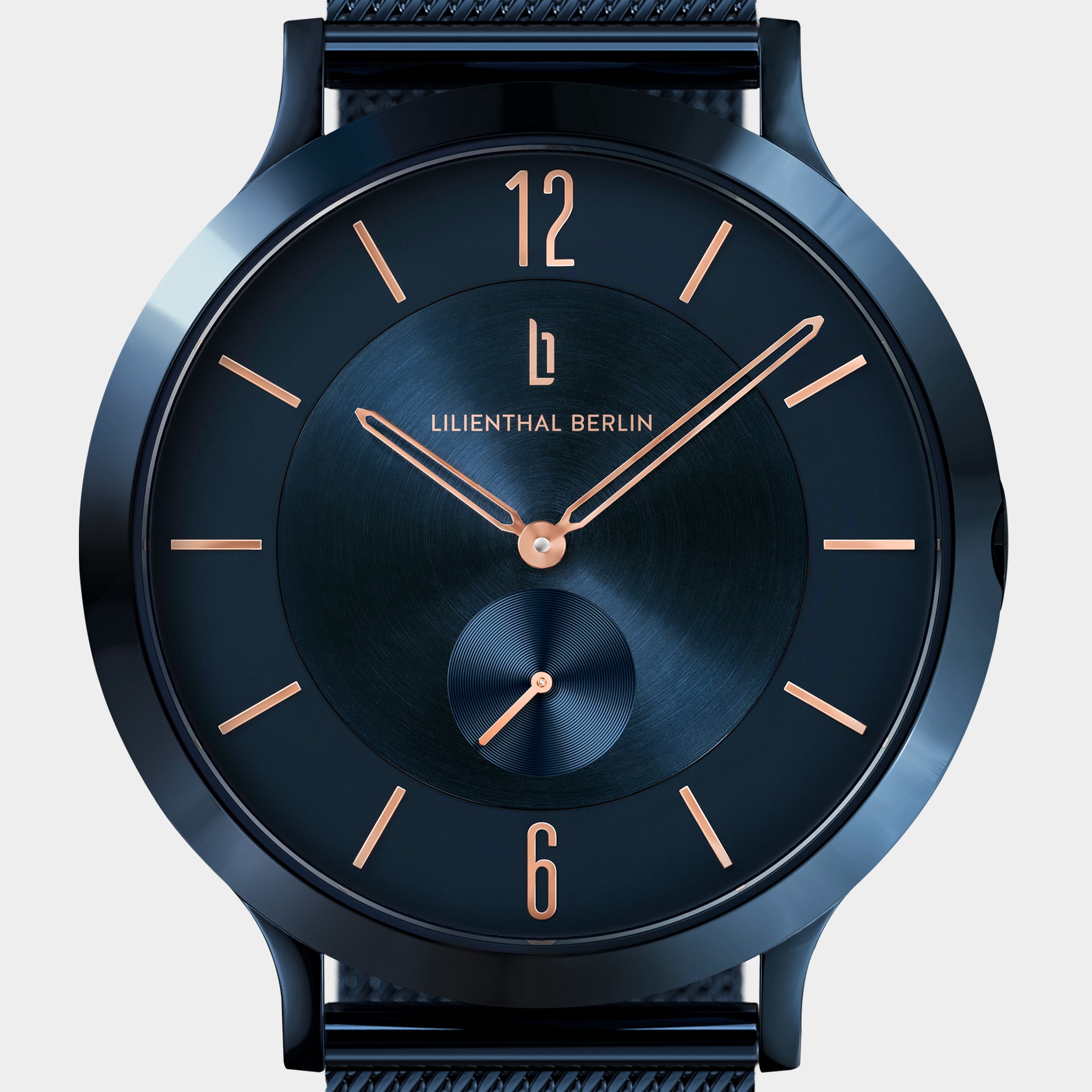 Modern black analog watch with gold hands and indices, minimalist design, close-up view.