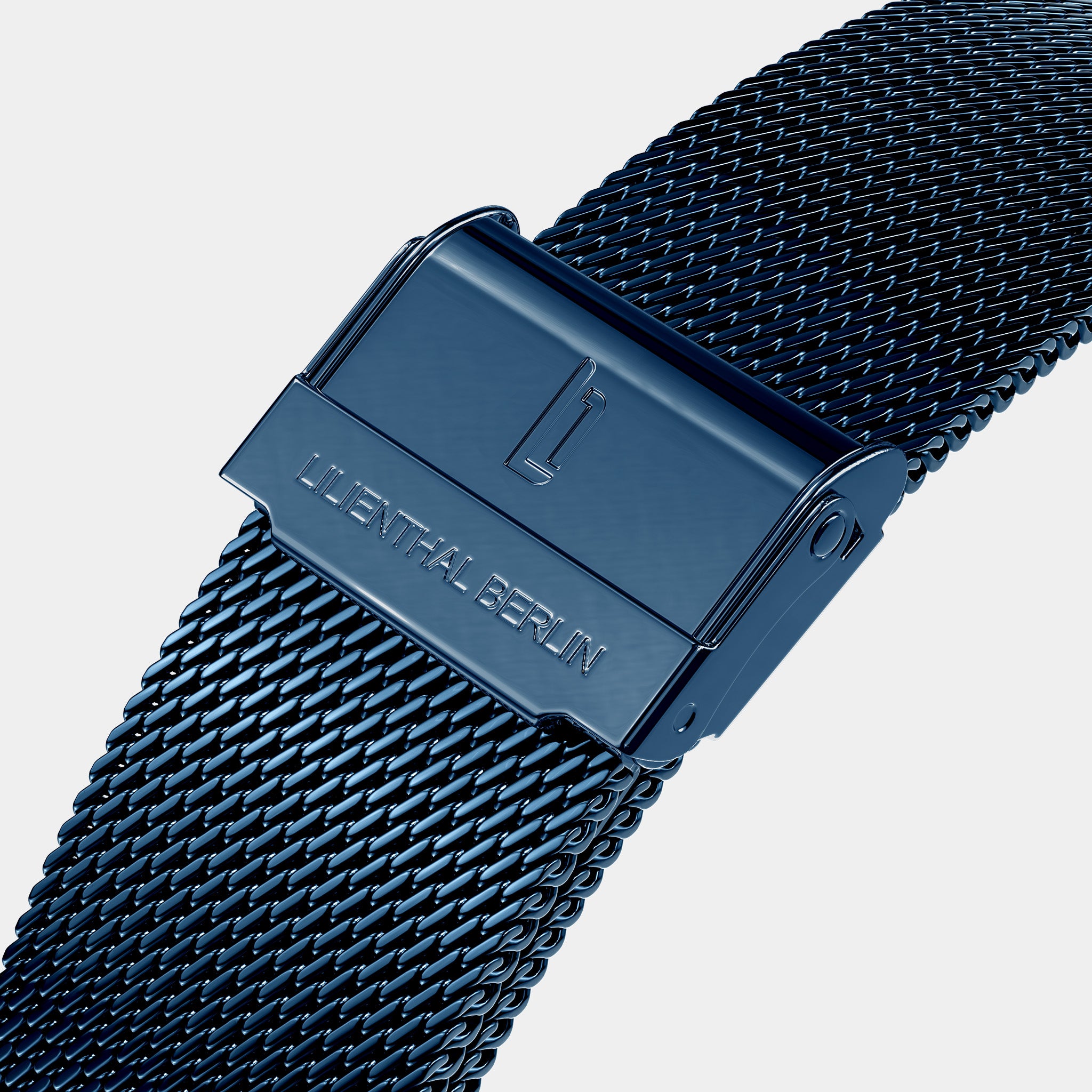 Close-up of blue mesh watch strap with engraved Lilienthal Berlin clasp on white background