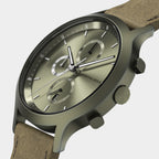 Close-up of olive green chronograph wristwatch with leather strap and sleek metal case