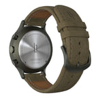 Stainless steel chronograph watch back with textured brown leather strap and metal buckle