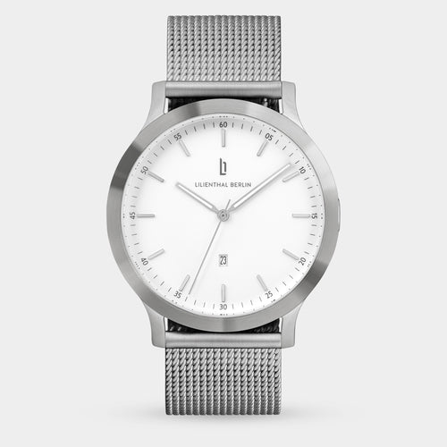 Minimalist silver mesh band watch with white dial and date display, modern design