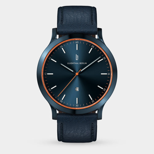 Elegant blue wristwatch with orange accents, leather strap, minimalist dial, date display