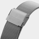 Close-up of silver mesh stainless steel watch strap with engraved clasp