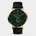 Gold case wristwatch with green dial, black leather strap, minimalist design