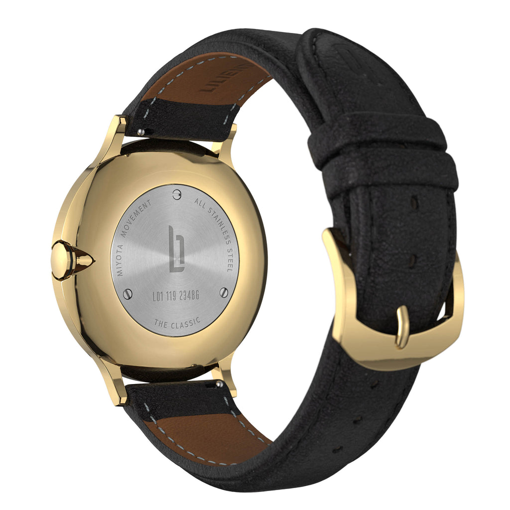 Back view of gold stainless steel wristwatch with black leather strap and engraved caseback